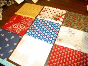 Three rows of three squares each, ready to be stitched together.